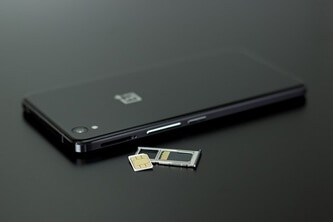 An image of a phone with its SIM card and SIM card tray taken out