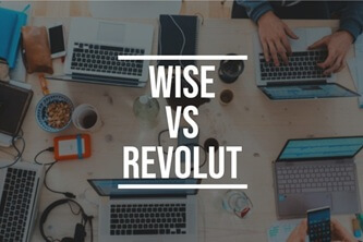An image of laptops and phones on a table with the title Wise ve Revolut printed on the forefront